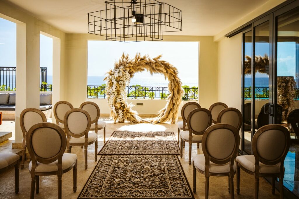 wedding ceremony set up on a terrace with ocean view