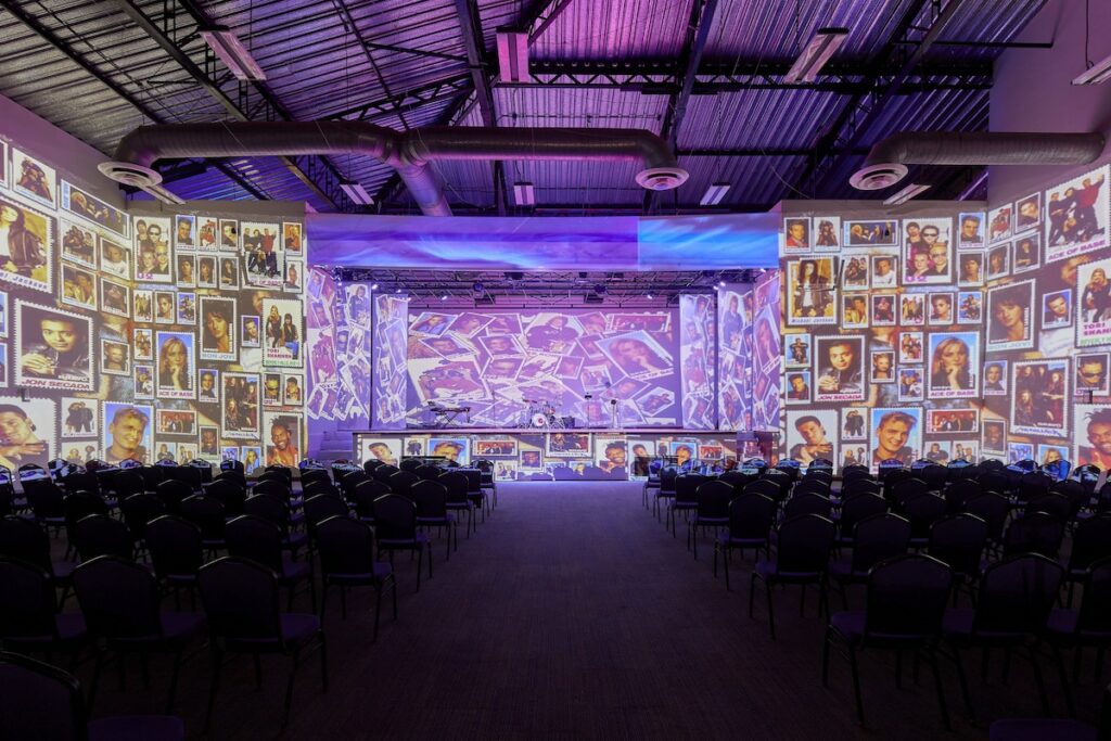 modern resort theatre with lights and images projected on the walls