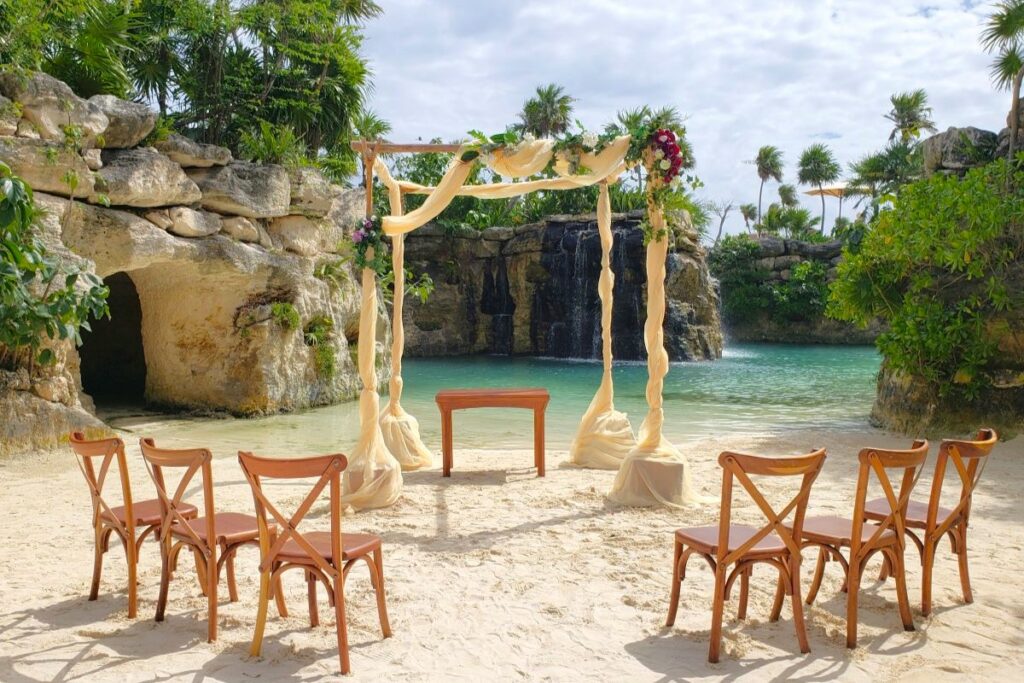 beautiful wedding ceremony set up on a private beach at hotel xcaret mexico