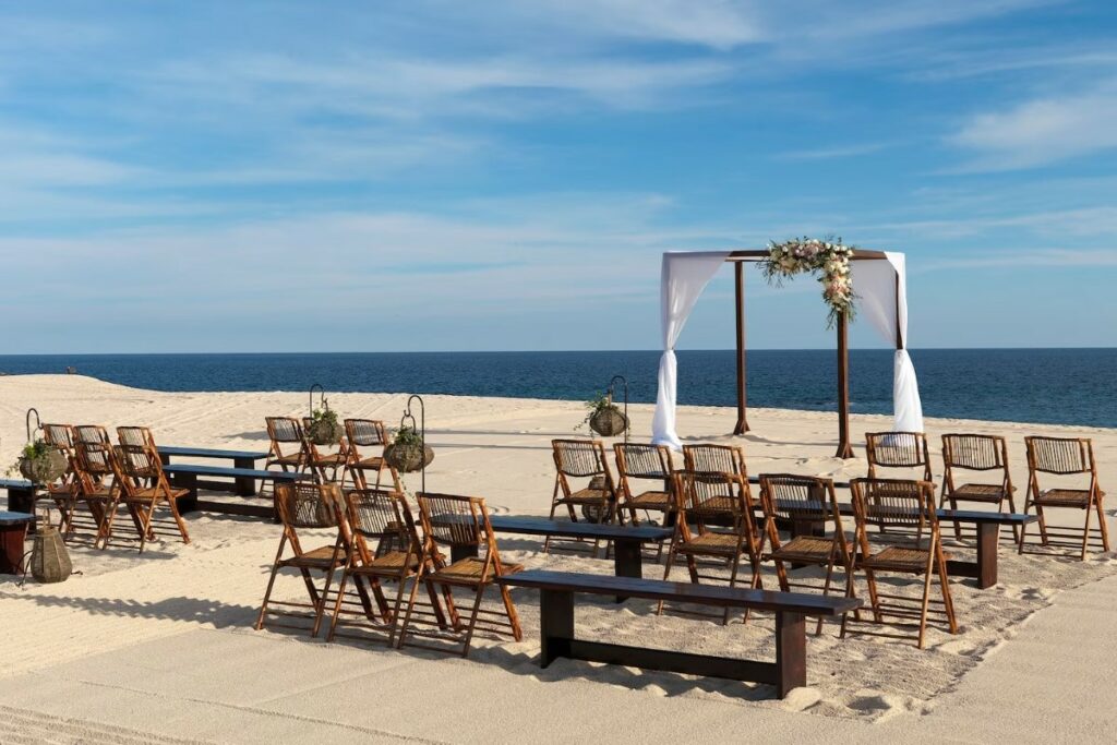 A wedding ceremony set up on a beach in Los Cabos, Mexico