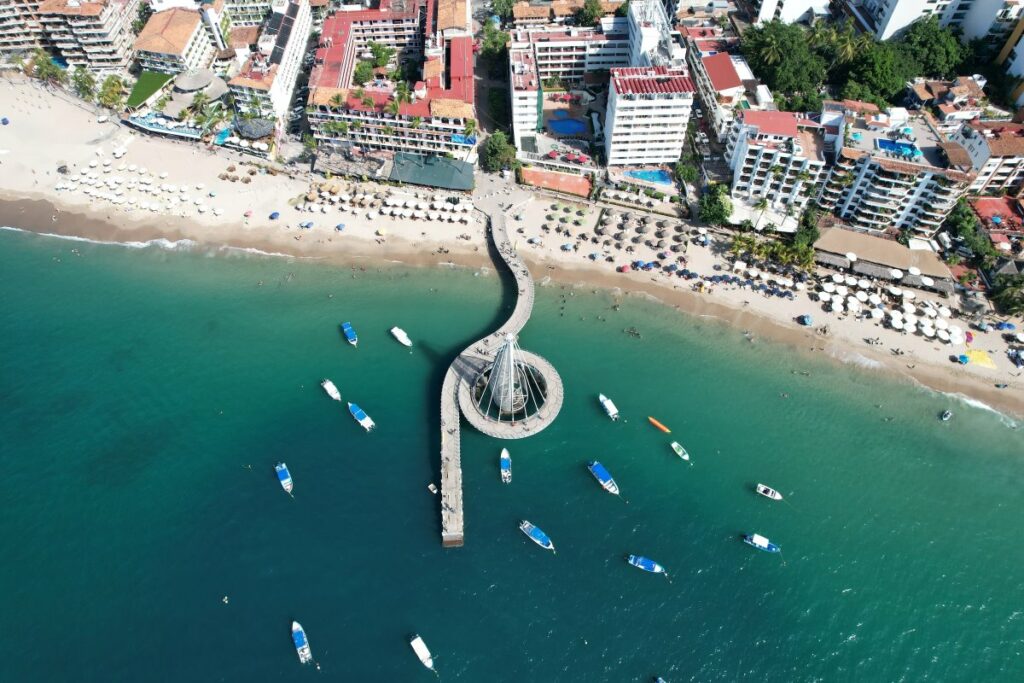 Aerial view of the main beach in puerto vallarta with the walking path above the water