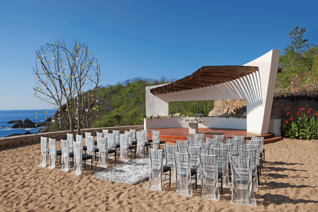 Modern beach wedding gazebo on the sand with ocean view at an all inclusive resort in Huatulco, Mexico