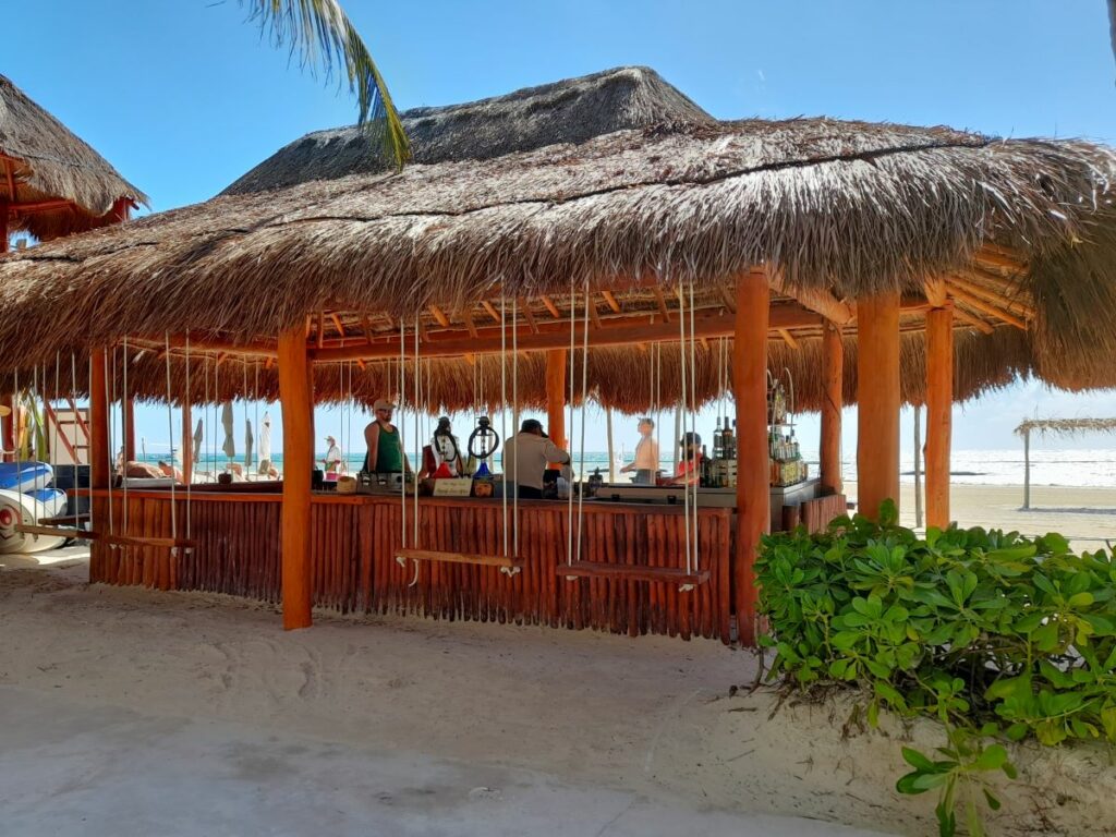 beach bar with palapa roof at el dorado maroma