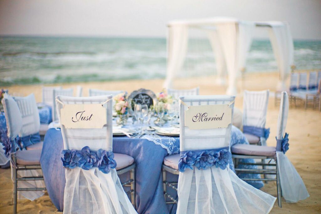 a beach wedding reception set up at el dorado maroma resort