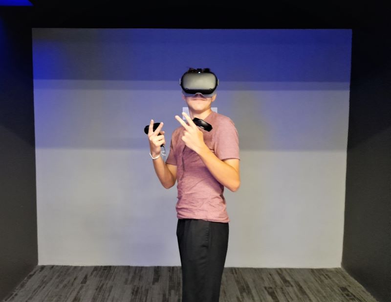 teenager posing with virtual reality lenses and glasses