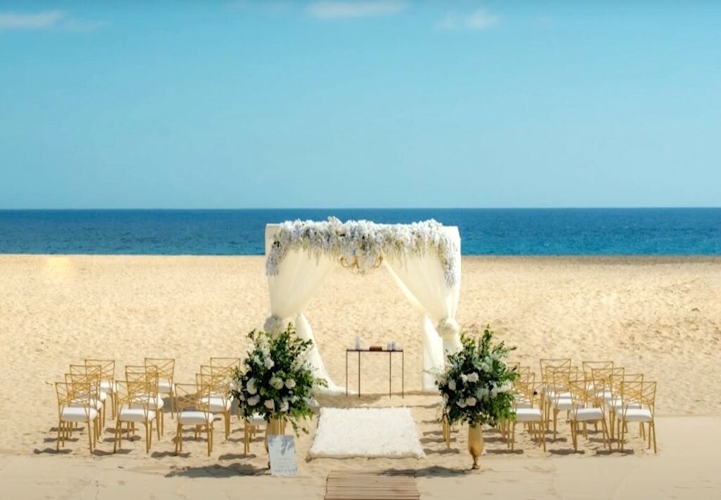 Nice wedding ceremony setting with a flowered white gazebo