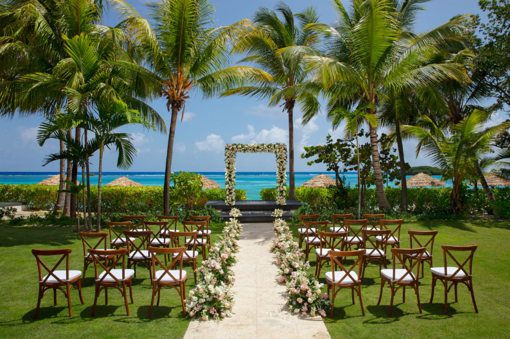 A setting for a wedding ceremony in a ocean view garden