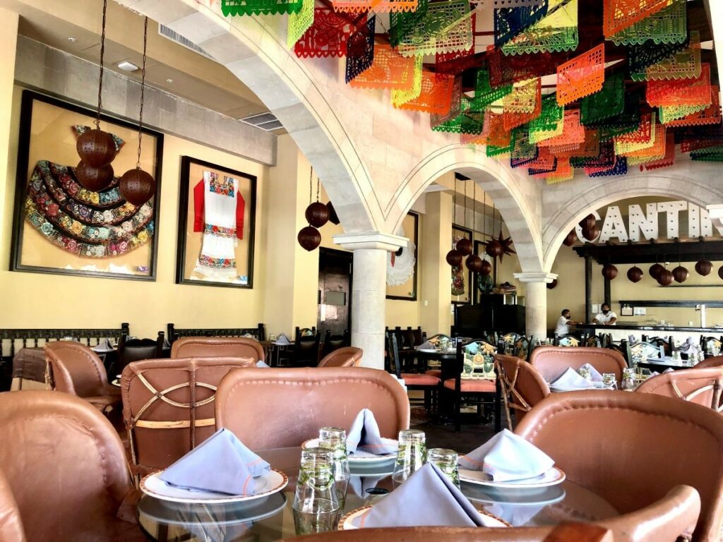 Mexican restaurant with folk art and leather chairs