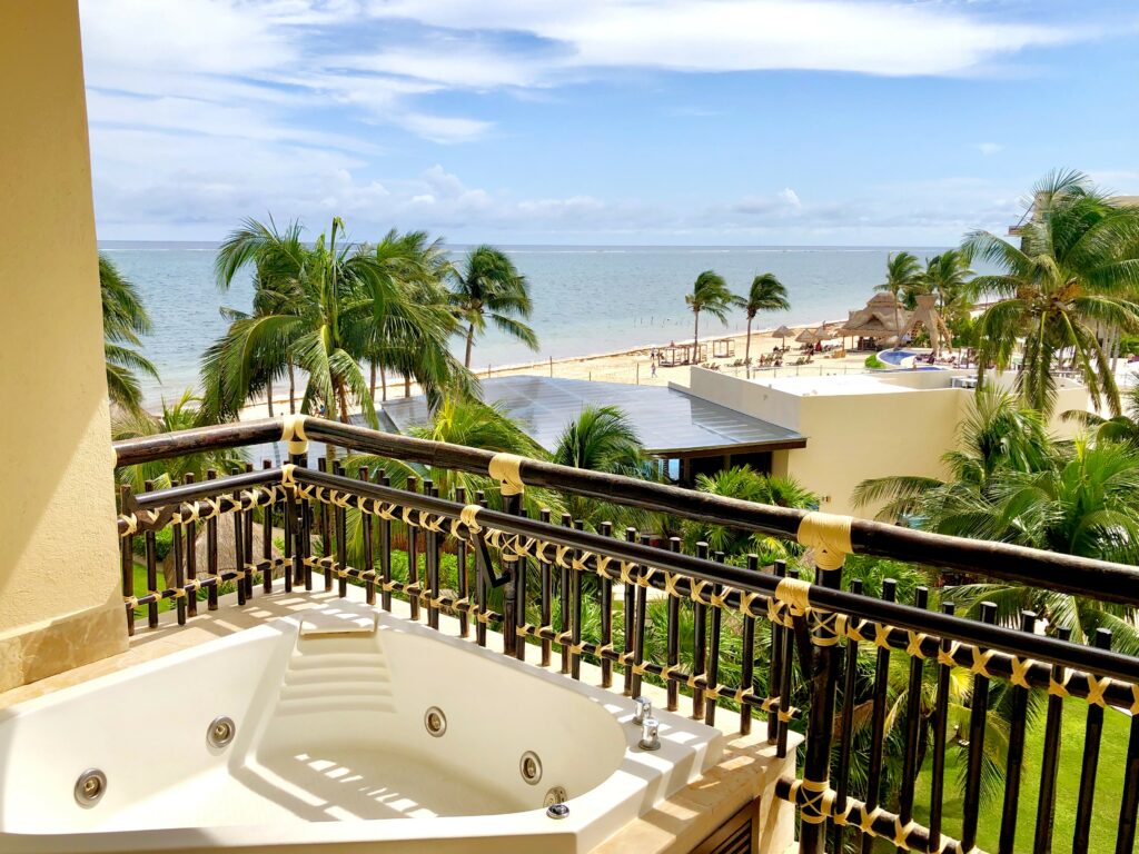 Hotel room balcony with jacuzzi overlooking the beach