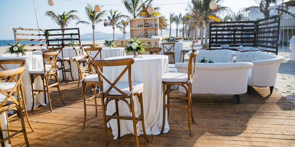 wedding terrace with wooden chairs and panoramic views in los cabos