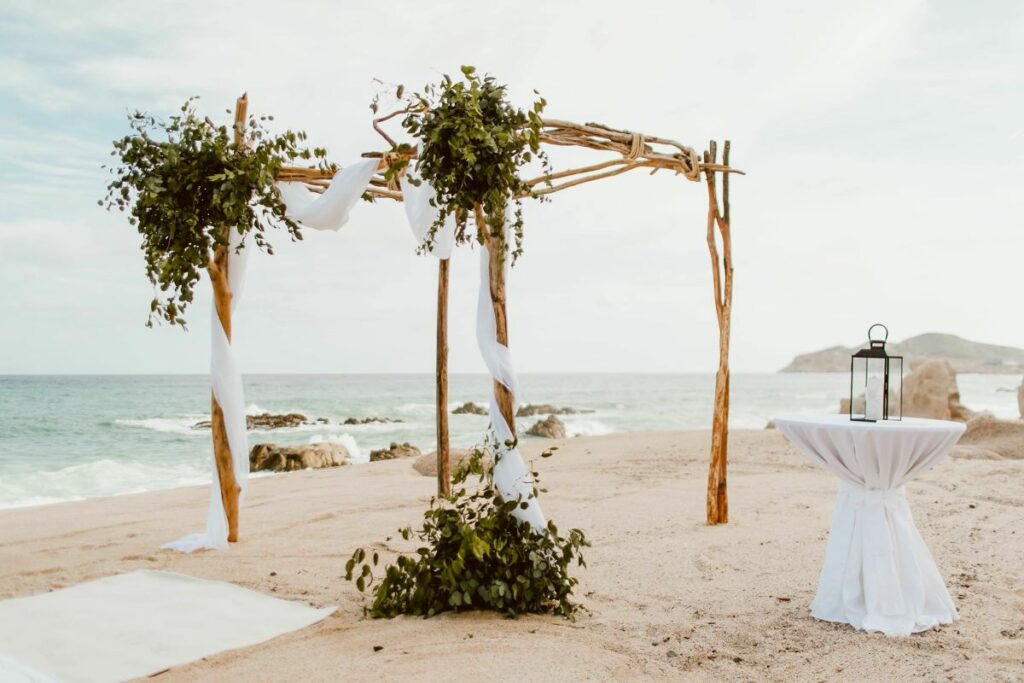 los cabos beach wedding ceremonny with greenery