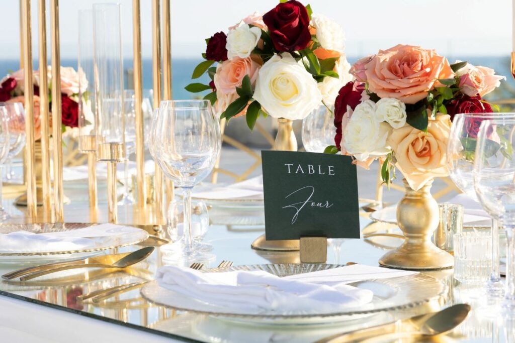 classic and romantic wedding table decor at a beach resort in los cabos