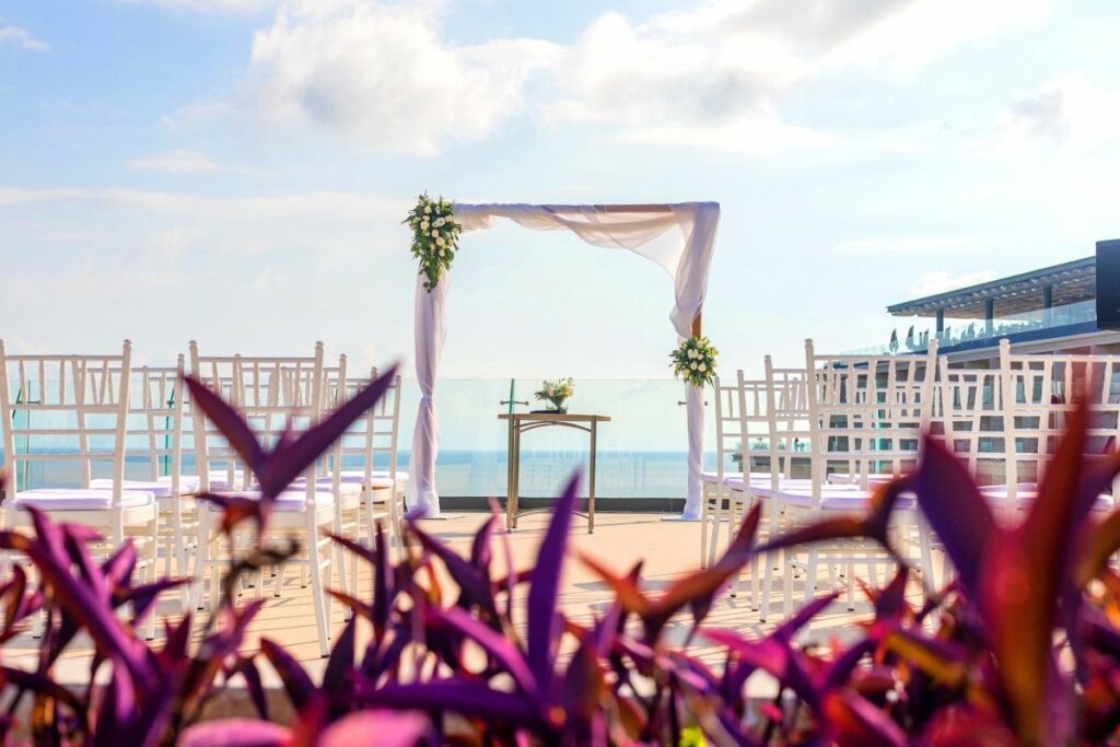 wedding ceremony set up on a terrace with ocean view at a beach resort in mexico
