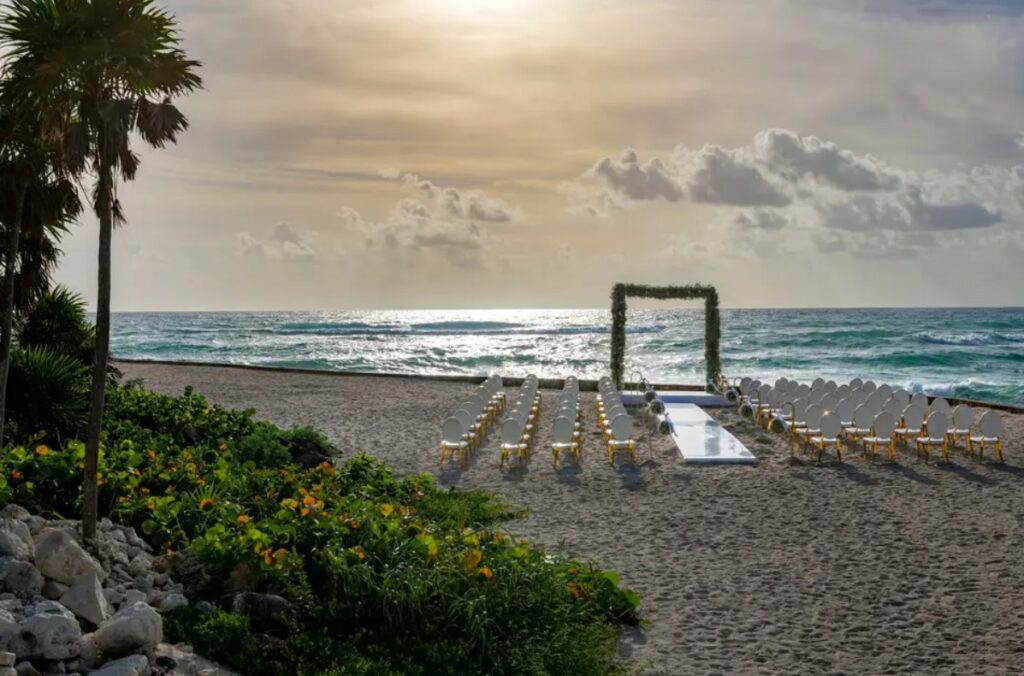 beach wedding ceremony set up in tulum