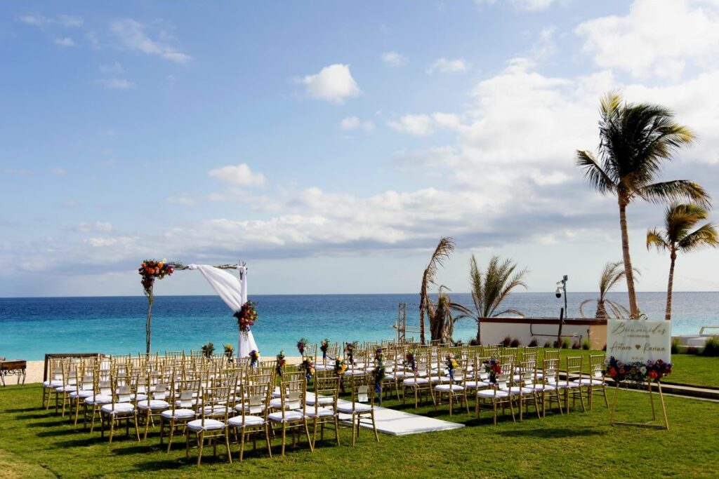 wedding ceremony setup with ocean view at a beach resort in los cabos