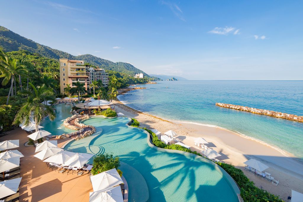 aerial view of the pools of a beach resort in puerto vallarta