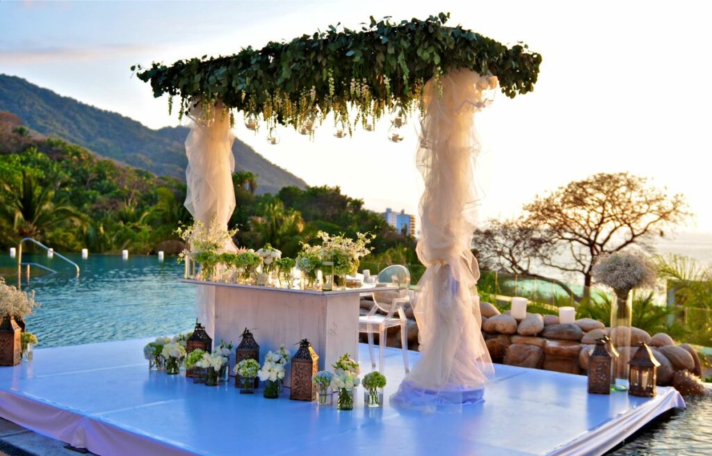 a wonderful over the water beach wedding ceremony at an all inclusive resort in puerto vallarta