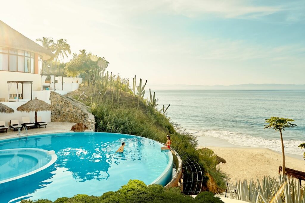 infinity pool with ocean view at a beach wedding resort in puerto vallarta